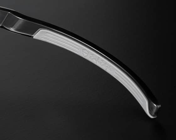 Macro detail of the HOLDFAST non-slip grip pads and flex temples on SafeStyle Performance safety glasses
